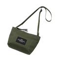 Introducing the Zipper Pouch Mini by Bags in Progress, a green canvas mini shoulder bag made from water-repellent, recycled polyester. It comes with an adjustable strap and features a black rectangular patch on the front.