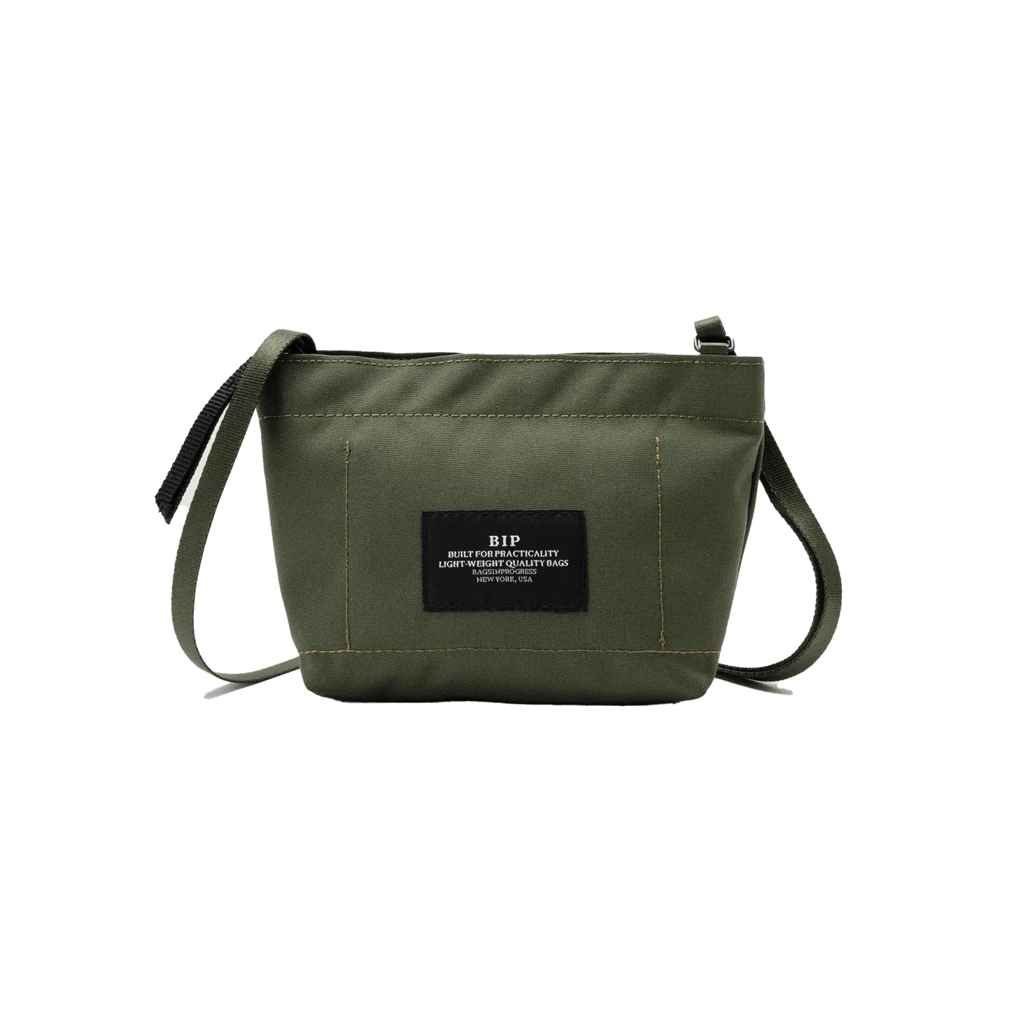 The Zipper Pouch Mini by Bags in Progress is a mini shoulder bag in olive green made from recycled polyester. It includes a black label on the front with text and offers water-repellent protection, featuring a single zip closure and an adjustable black strap, ideal for everyday use.